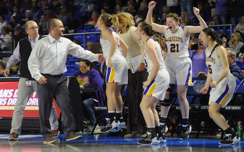 The Viqueen bench erupts after the final buzzer sounded that sent the Viqueens to the Class 2A state semifinals.