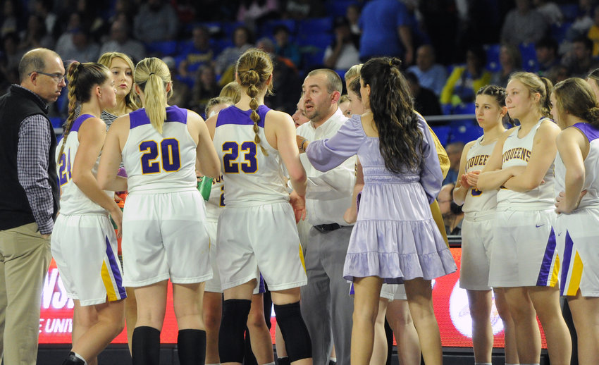 The Community Viqueens huddle up with coach Cody Pierce during the second half of Friday night&rsquo;s Class 2A state semifinal matchup with Westview.