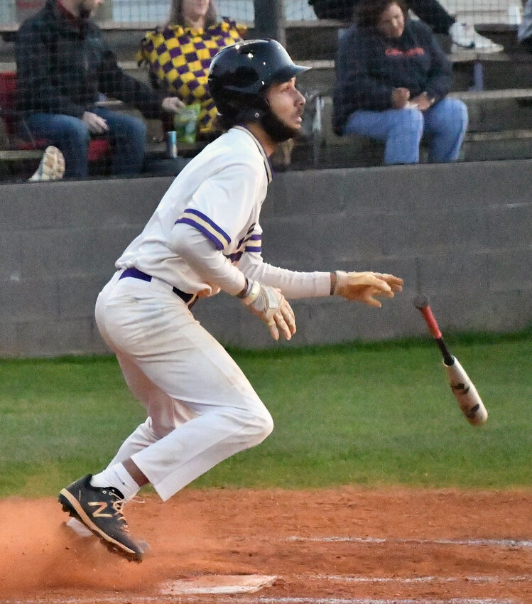 Maki Fleming of the Vikings drops his bat after delivering a triple in the third inning.&nbsp;Fleming had four hits and four RBIs for Community.
