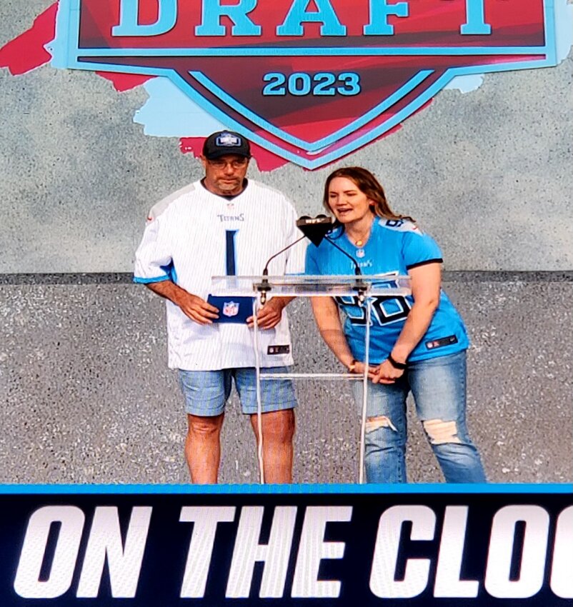 Local Titans fan and longtime season ticket holder, Scott Claxton, announces the Titans' sixth-round pick with Crystal Cole on Saturday.&nbsp;