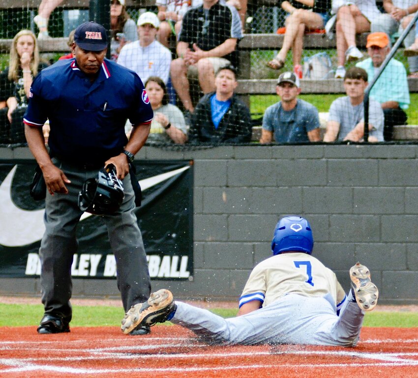 Nick Johnson slides in at home plate to score&nbsp;the first run of the game in Shelbyville Central's region tournament match-up with Bradley Central on Friday.