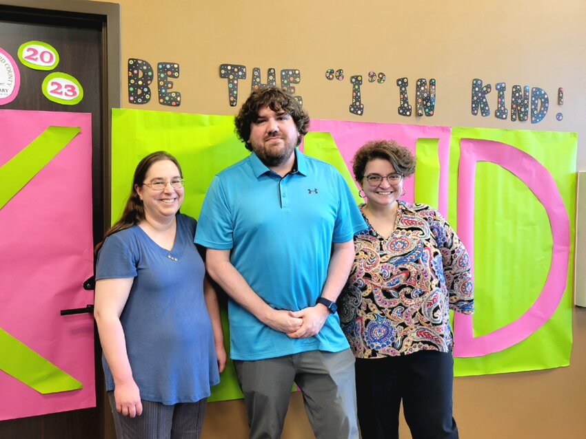 From left, library staff Emilee&rsquo; Le Clear, Caleb Harris, and Hayley Clanton.