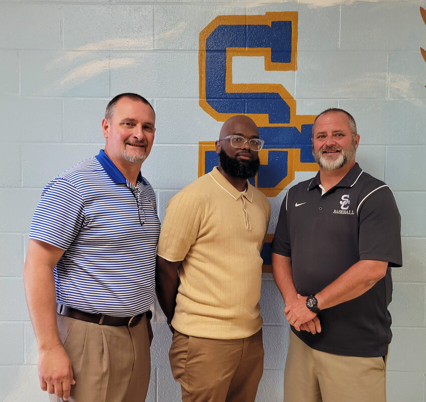 After an extensive search led by Shelbyville Central principal Charlie Pope (left) and athletic director Dee McCullough, Shane Young has been hired to take over the Eagles basketball program.