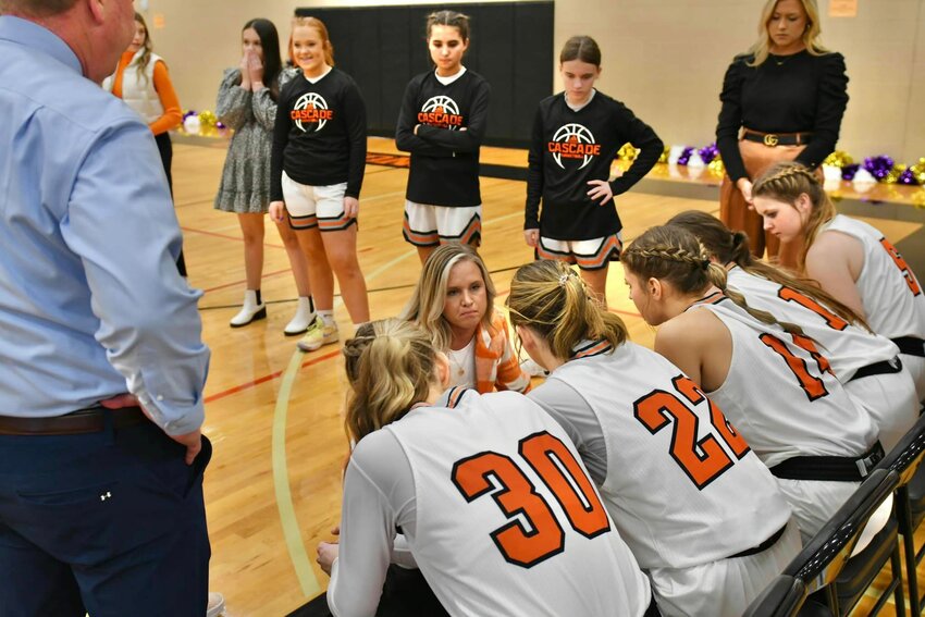 Cascade's Janie Demonbreum (center) giving her team some final instructions in the pre-game huddle.