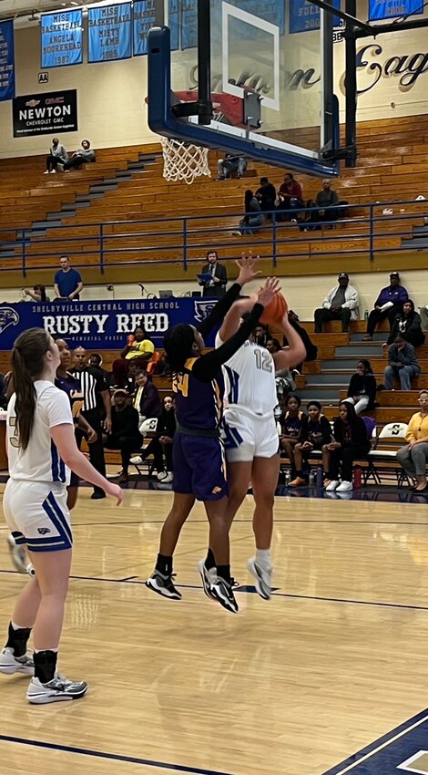 Lily Brown (12) goes up for two of her eight first-half points on Monday.