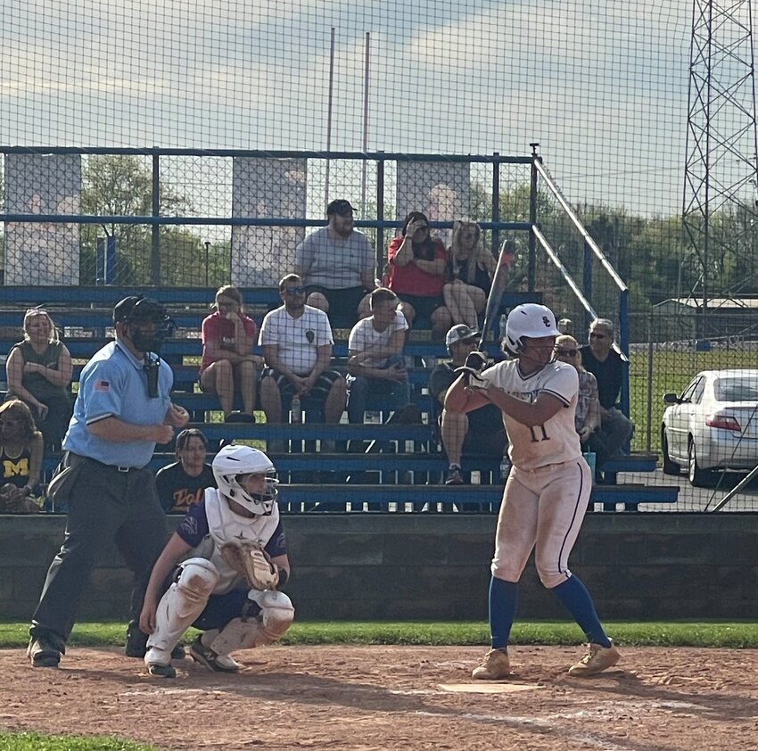 Lilly Brown (11) digs in before her sixth inning two-run home run against Columbia Central on Sunday. Brown went 2-3 on Sunday with a double and that home run.