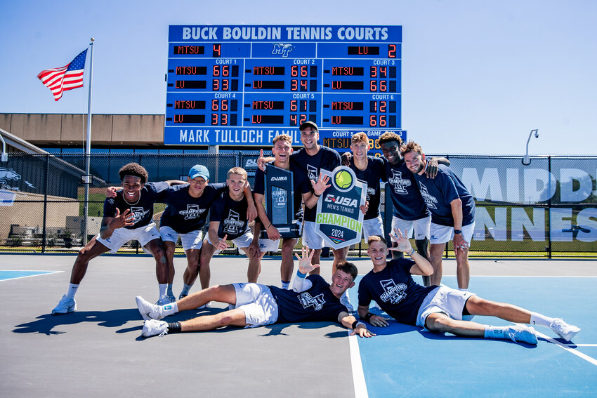 MTSU Tennis poses with the C-USA Tournament Championship Trophy after winning their fifth-consecutive conference title.