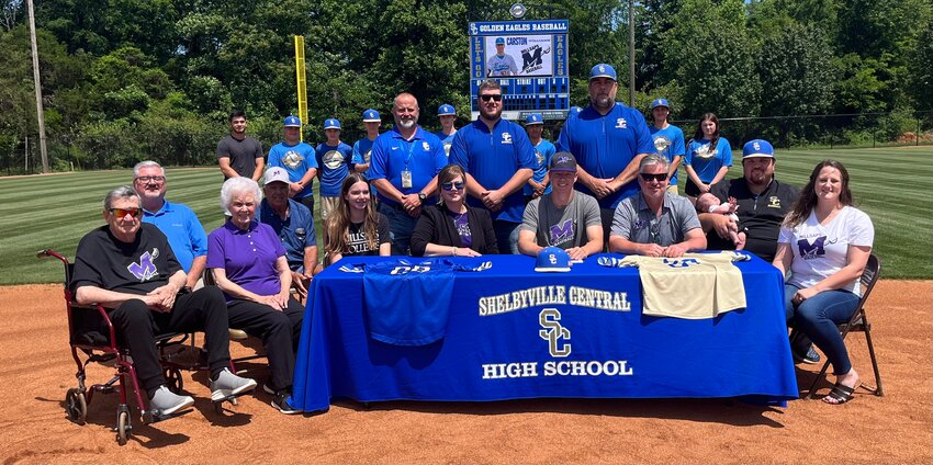 Carston Williams (center) officially put pen to paper on Monday to continue his baseball career at Millsaps College in Jackson, MS.