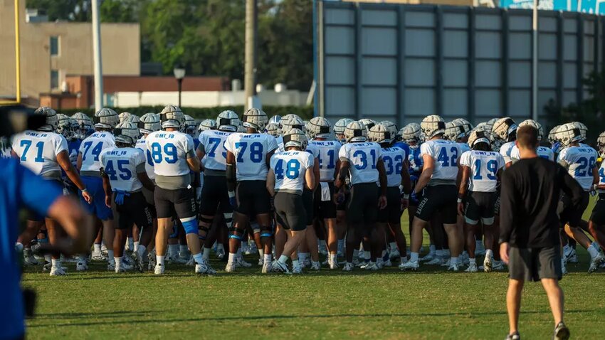 The Blue Raiders huddle up to begin practice in preparation for the home opener on August 31st against Tennessee Tech.