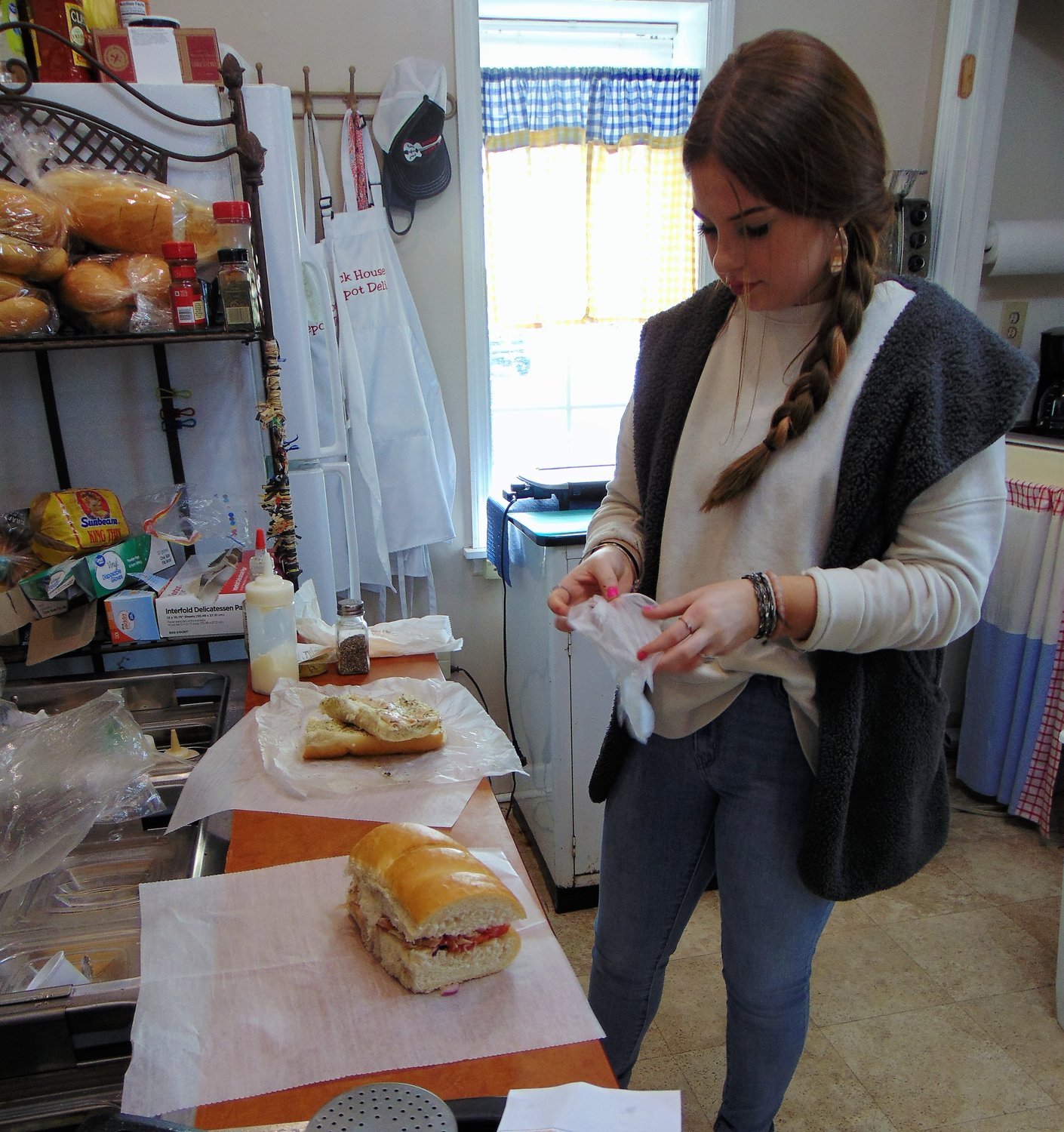 Kerry Brewer makes their most popular sandwich, “The
Strollin’ Jim.”