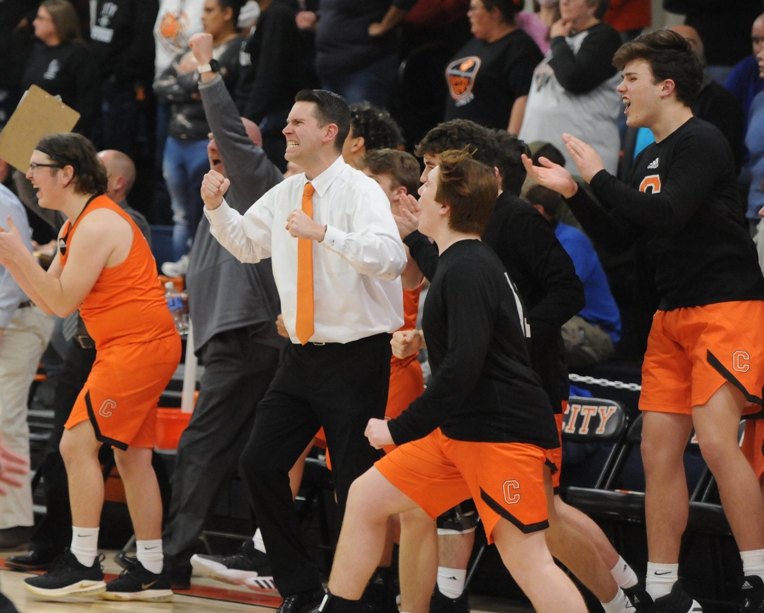 The Cascade bench erupts in emotion after the final buzzer in the Region 4-A semifinals at Fayetteville City.