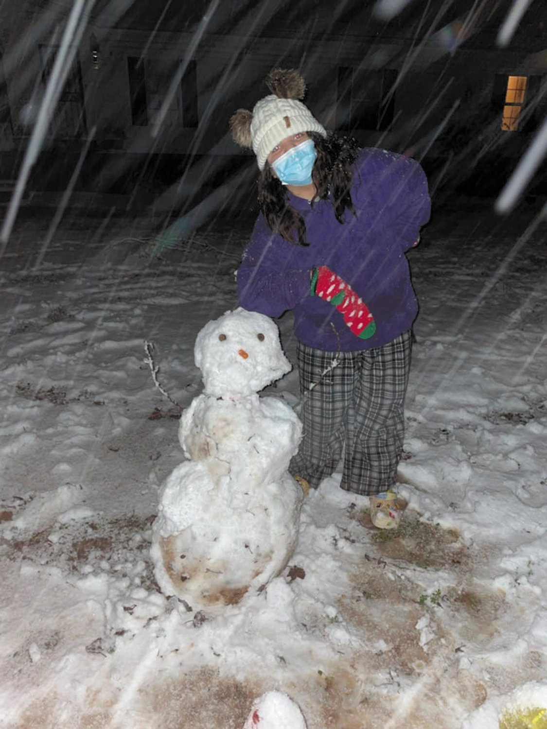 What better time for Olivia Grammer to build a snowman than during a snowstorm?