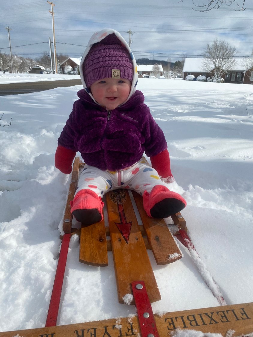 Blakely Summers, age 7 months, takes a sled ride. She is the daughter of Joseph and Shelby Summers.
