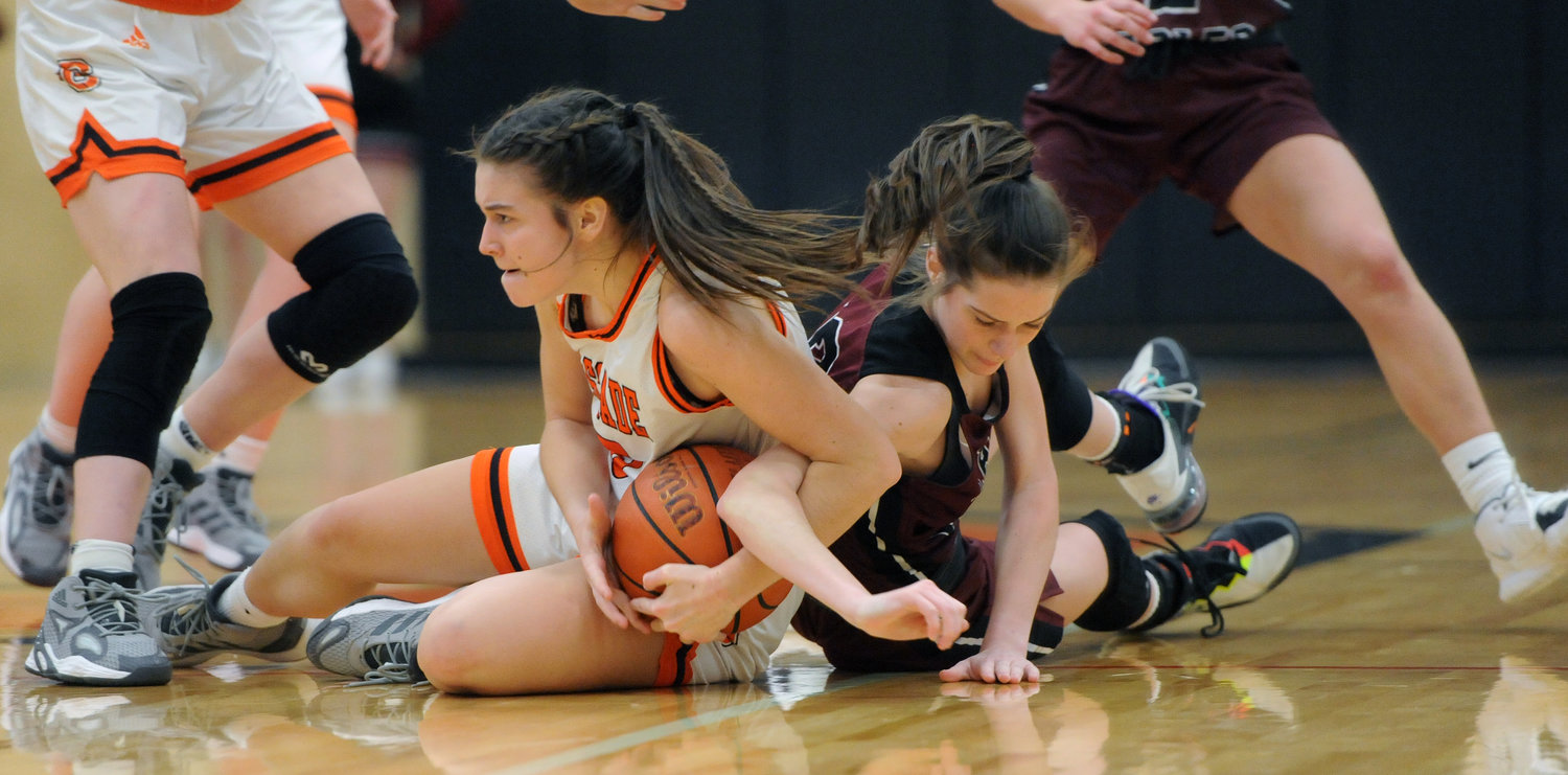 Caroline Stone muscles the ball away from Eagleville and wins a possession for Cascade on Tuesday night. She finished with a team-high 11 points.