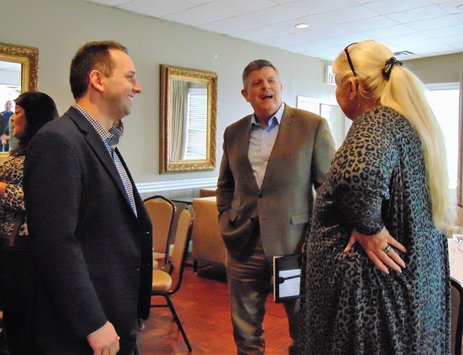 New Shelbyville-Bedford Chamber of Commerce President, Josh Lynch, left, talks with
Scott Johnson (former Bedford EMA Director), and Chamber CEO Lacey Deeds.