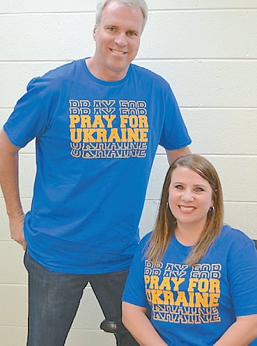Steve Flippo and Felisha Sudberry sport some of the latest, “Pray for Ukraine” T-shirts. They are available from
Sew Sudberry, with all proceeds, they said, going to help
those in need of the war-torn country. Sunday will be
observed as “Pray for Ukraine Day."