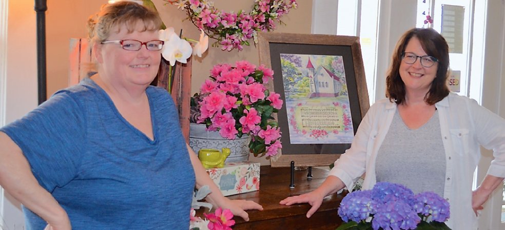 Paula Williams, left, and Jenifer Moore prepare Easter displays at Flowers for Keeps at813 Union St.