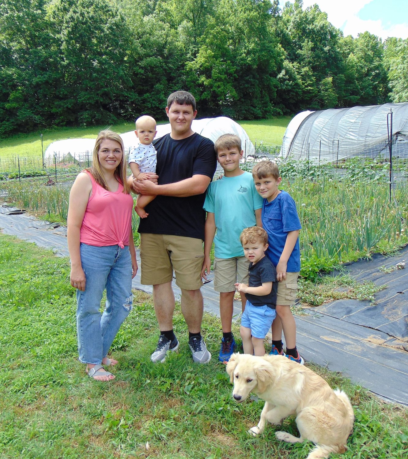 Enjoying life on the farm in Petersburg are Jessica, Huck, Matt, Hayden, Harvey, and Henry Waid.