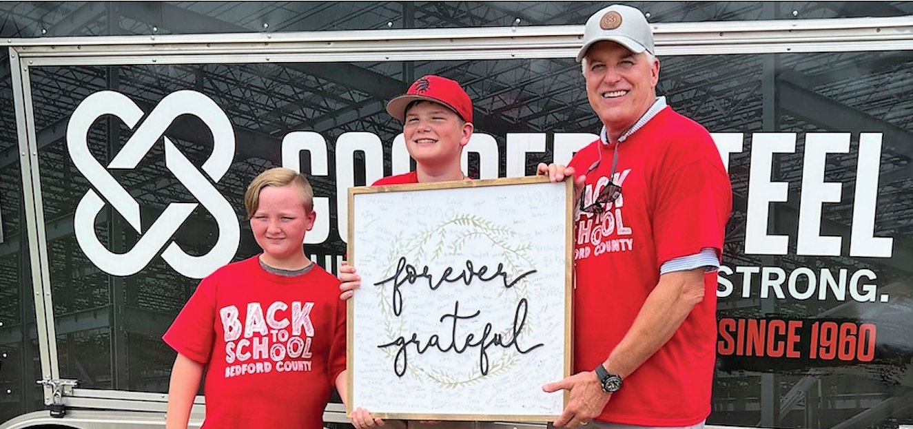 Noah Fletcher and Charlie Pirtle thanked Cooper Steel for its amazing contributions to Saturday’s Back-to-School Bash.
