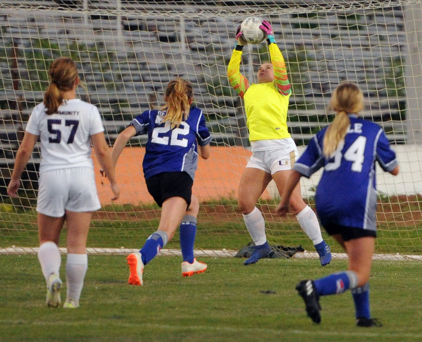 Community keeper Carlie Blanton makes a save on a long shot by the Lady Rockets.