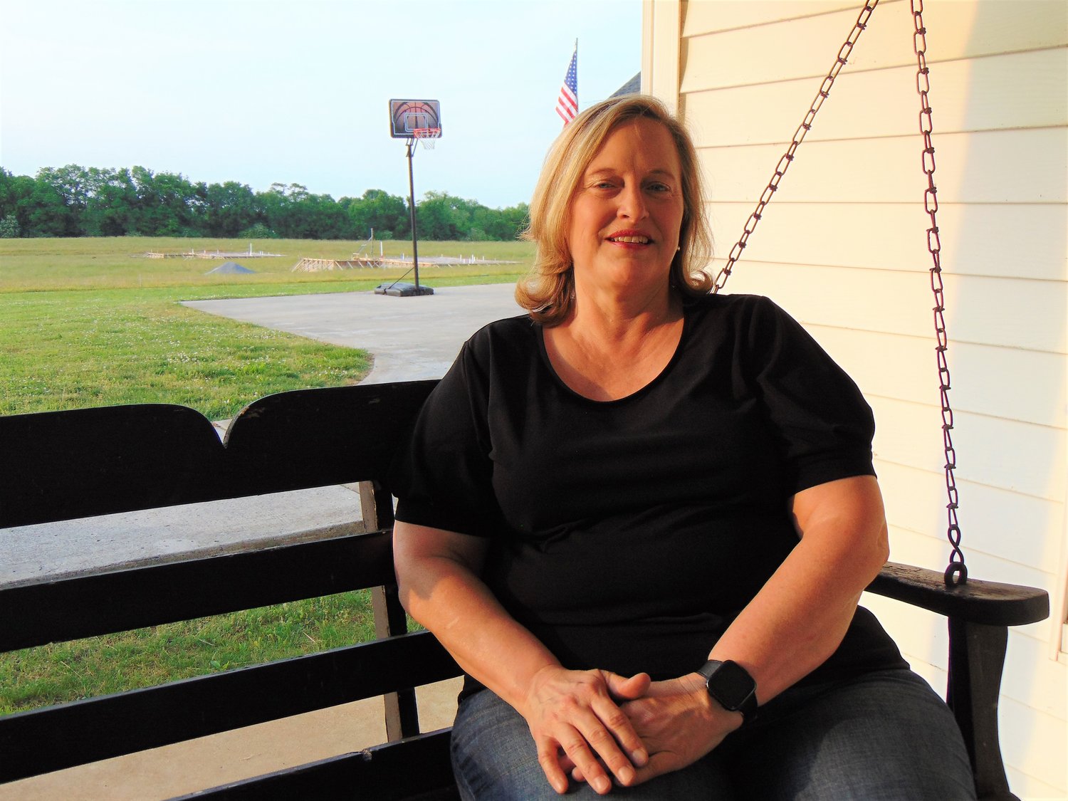 Daphne Motes enjoys sitting on the front porch on a
warm summer evening. She purchased her family home
in March.