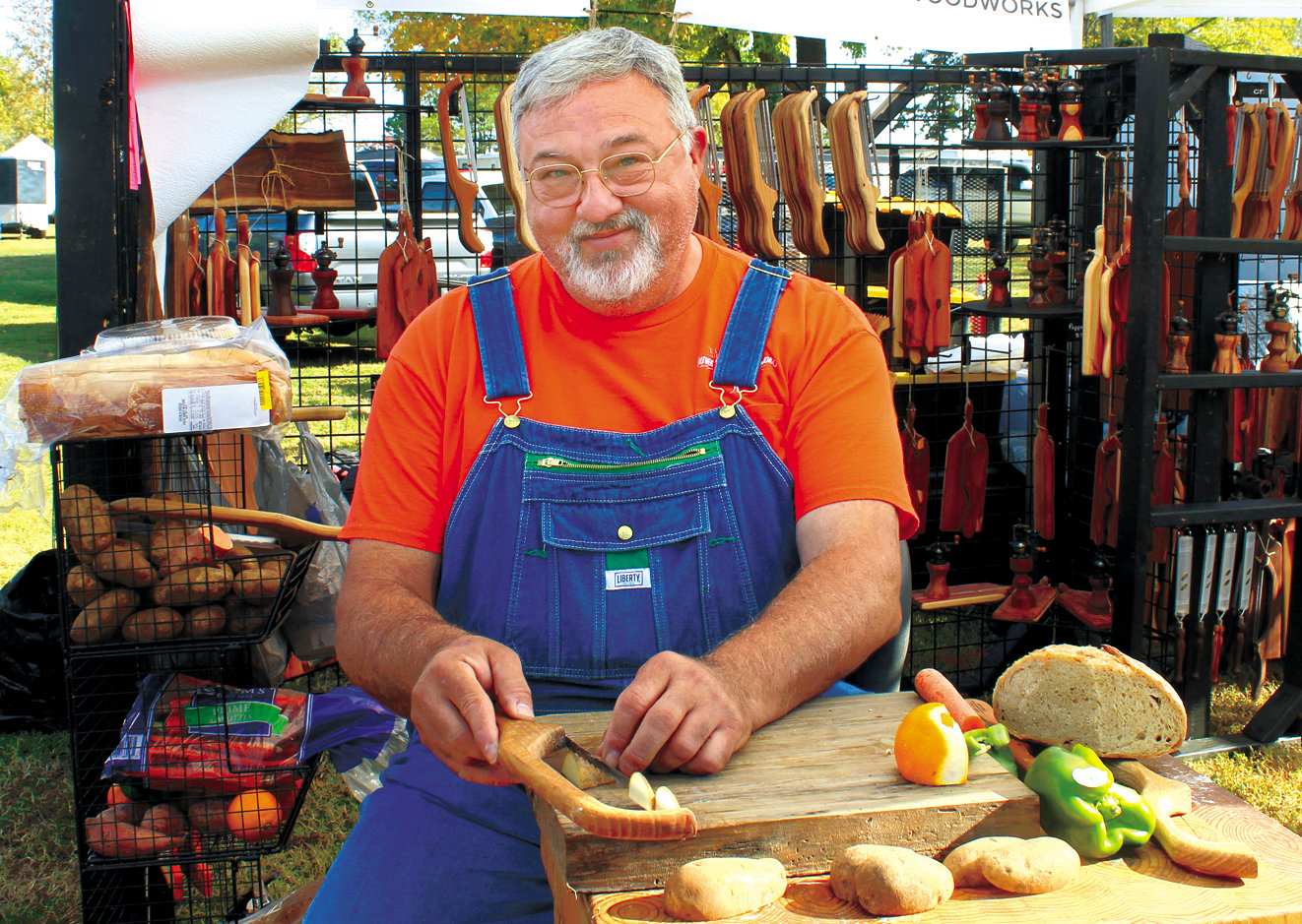 Steve Hopper, of Wheel, was selling knives and demonstrating them by peeling vegetables Saturday at the annual Bell Buckle-Webb School Arts & Crafts Fair.