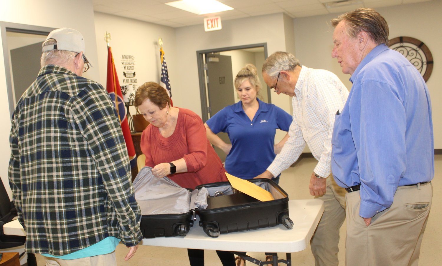 Members of Bedford County Election Commission open the suitcase containing results from the  East Side School precinct in Shelbyville following Tuesday’s elections.
