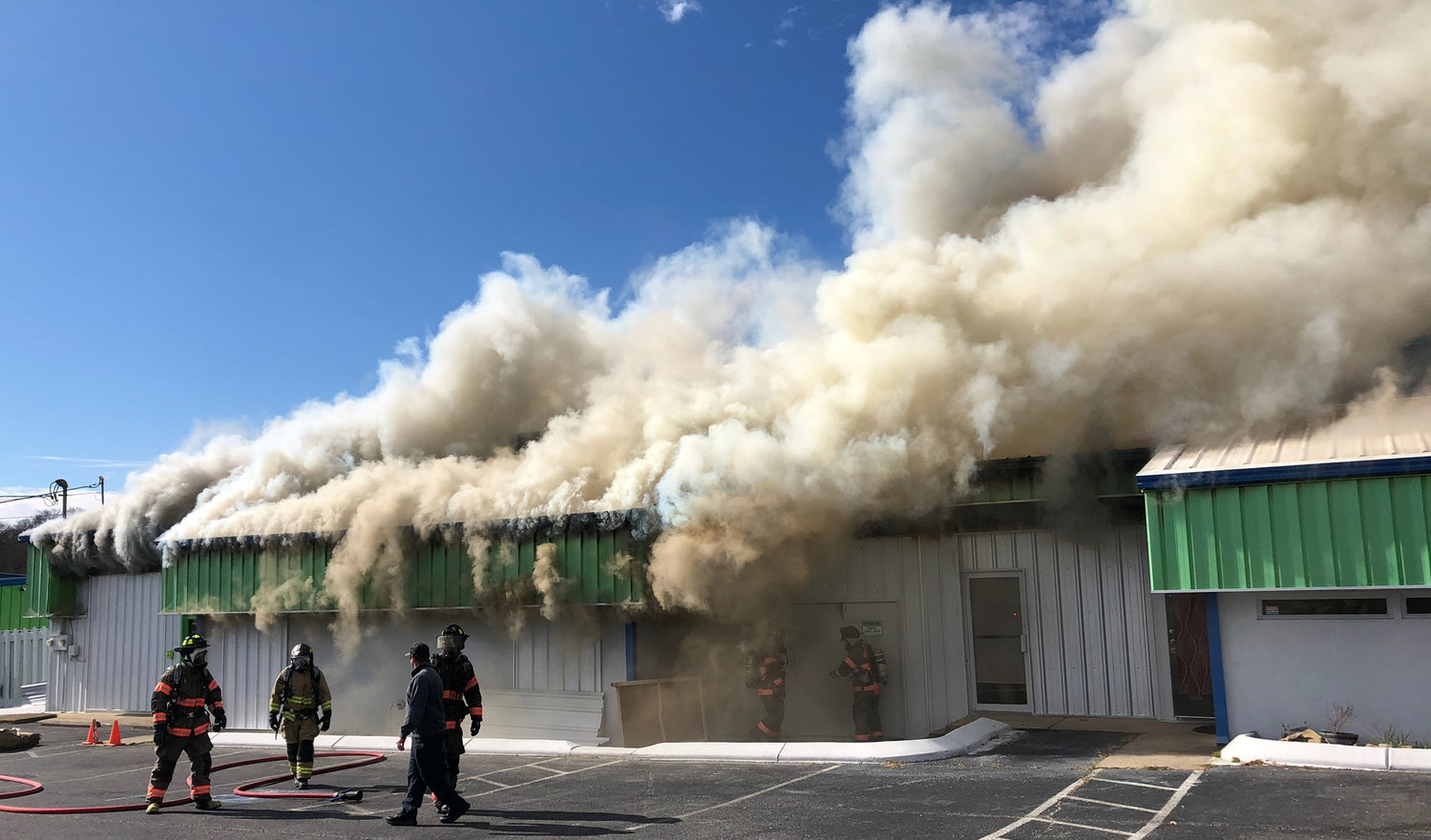 Shelbyville firefighters battle a blaze at midday Monday at Shelbyville Self Storage, Bethany Lane. At one point the building was almost completely obscured by smoke.