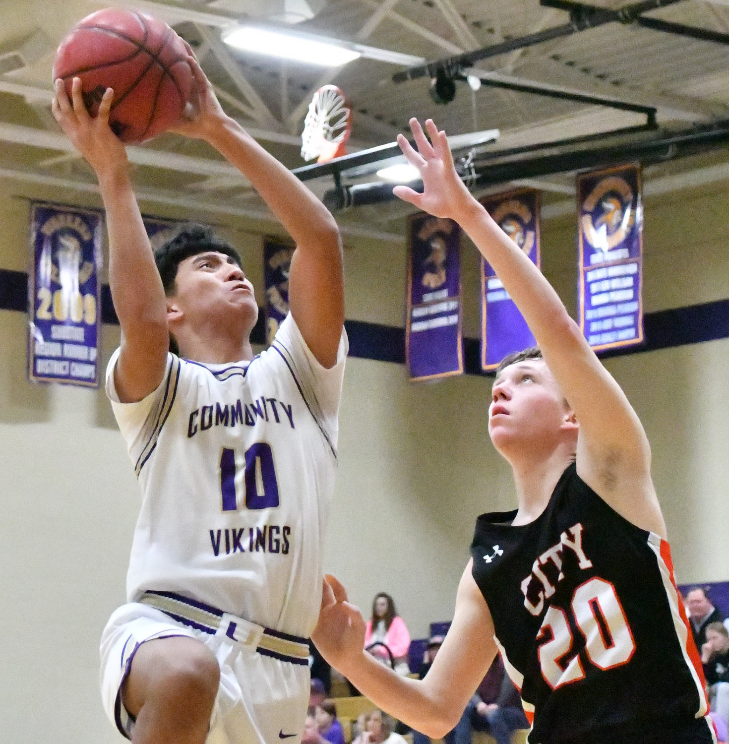 Ramone Hernandez (10) of the Vikings is fouled as he goes up for a shot.  Hernandez had six points for Community.