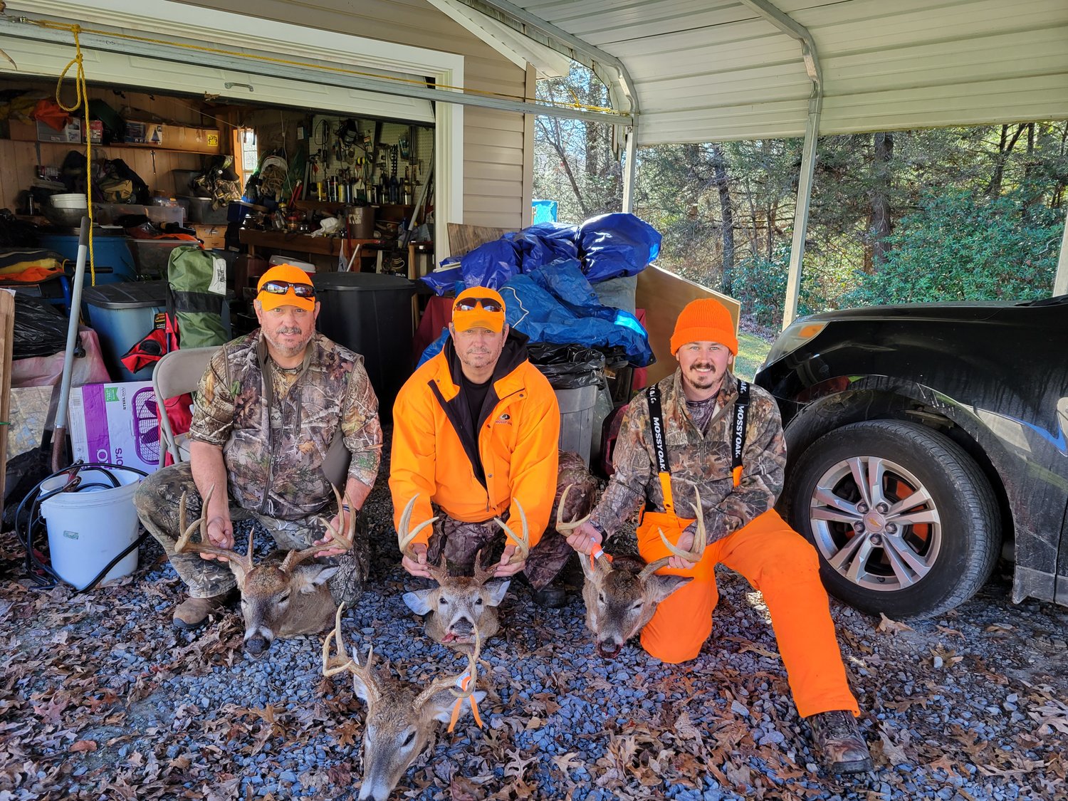 Sports editor Chris Siers is pictured with his six-point (far right), his dad with his 10-point, uncle Gary with his eight-point and his grandpa's (not pictured) eight-point after a week of hunting in West Virginia last week.