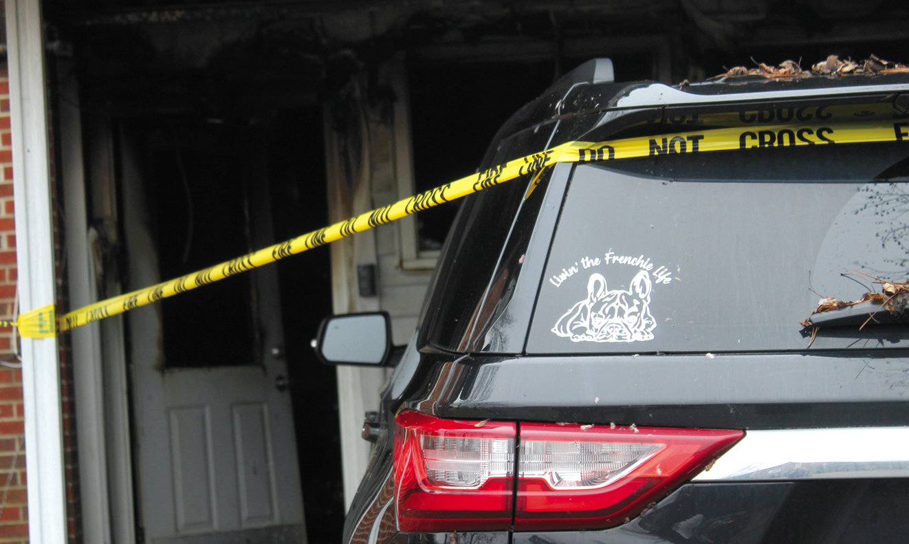 “Livin’ the Frenchie Life,” the window sticker says. Investigators said two dogs survived the blaze.