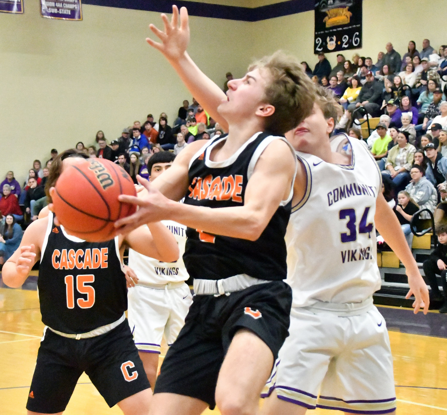 Jayden Gulick drives to the basket for the Champions. Gulick had four treys and 21 points in the Cascade win.