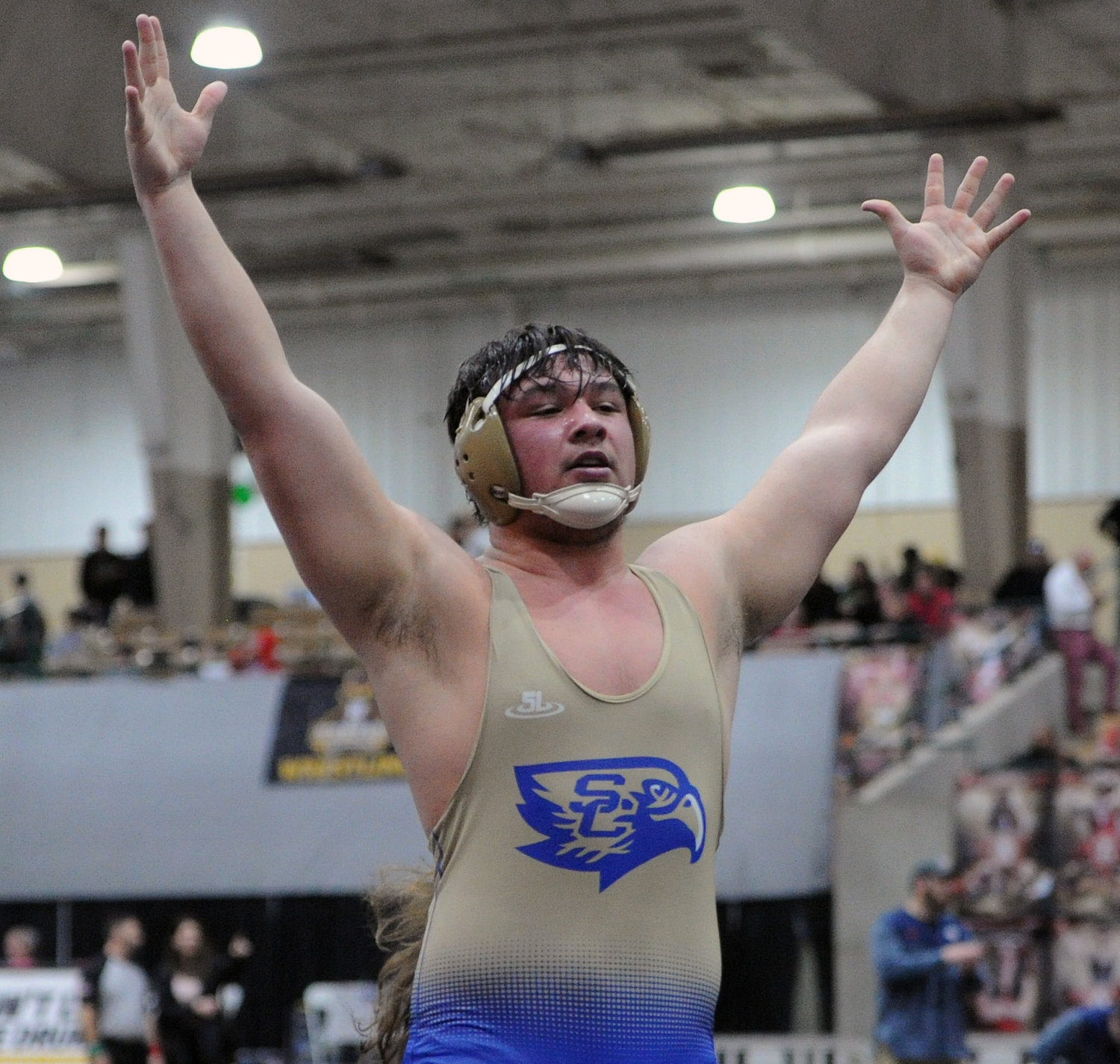 Logan McBee celebrates after he defeats Maryville’s Peyton Cooper in the Class 2A 220-pound weight class match for third place. He won the match in a 5-2 decision.