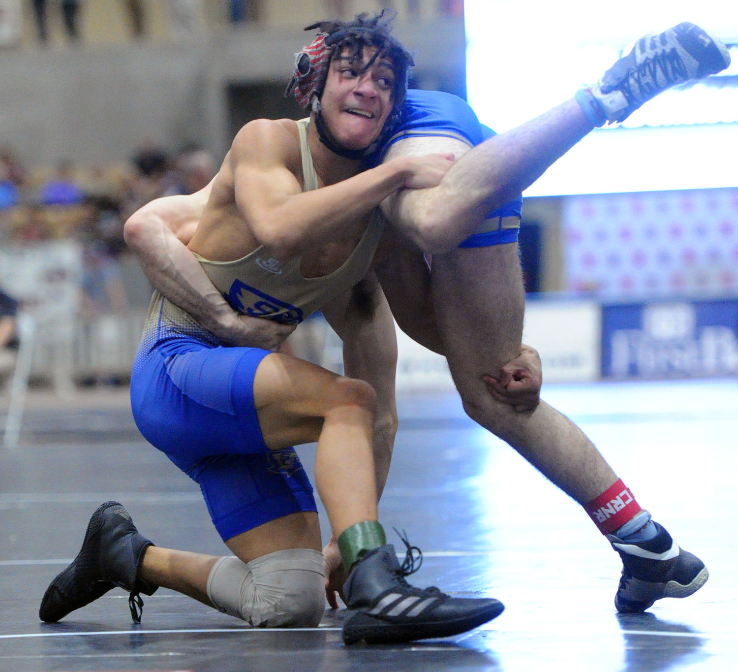 Landon McCroskey upends his opponent in the first match of the 152-pound Class 2A bracket on Thursday.