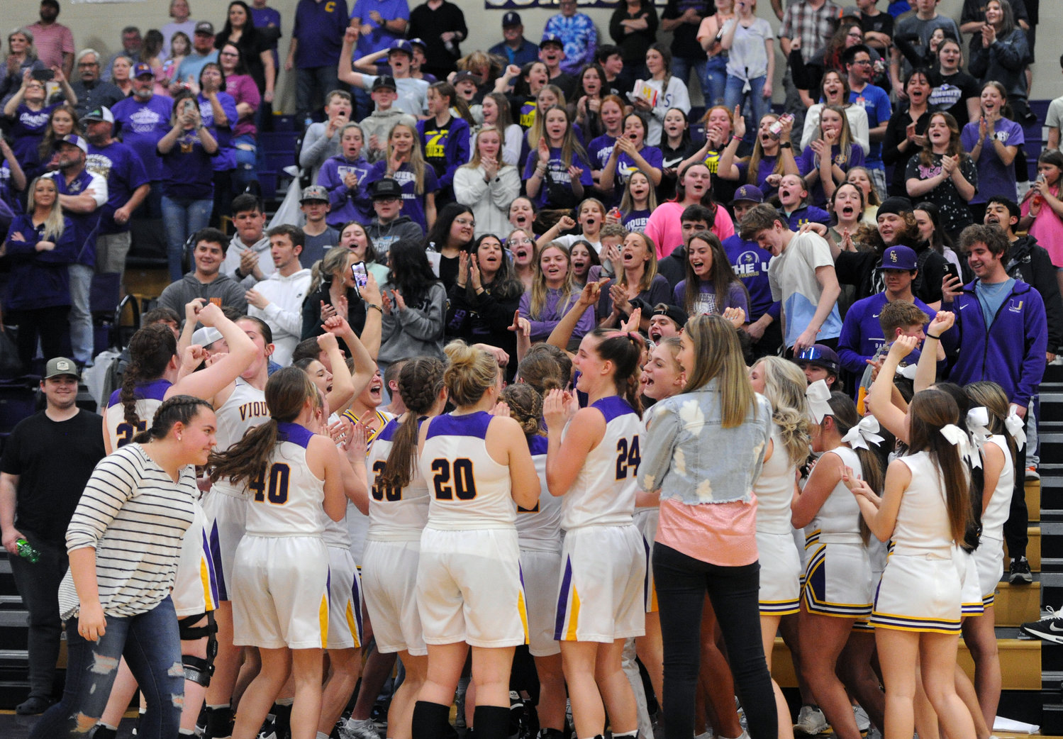 After the final buzzer sounded, the Community Viqueens rush to celebrate their second-straight region title with the student section.