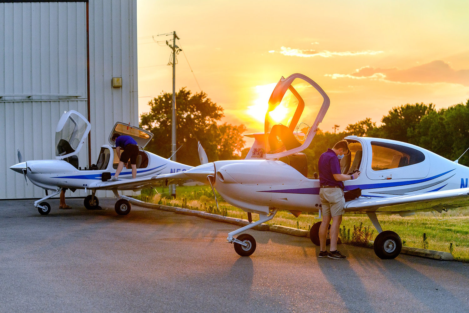 In the summer 2020 file photo, MTSU Aerospace students and certified flight instructors Ryan Patterson, front, and Cole Ferraro and Copher Kashif prepare to fly the newest additions to the MTSU fleet of Diamond aircraft from the Canadian factory to the Murfreesboro Municipal Airport.