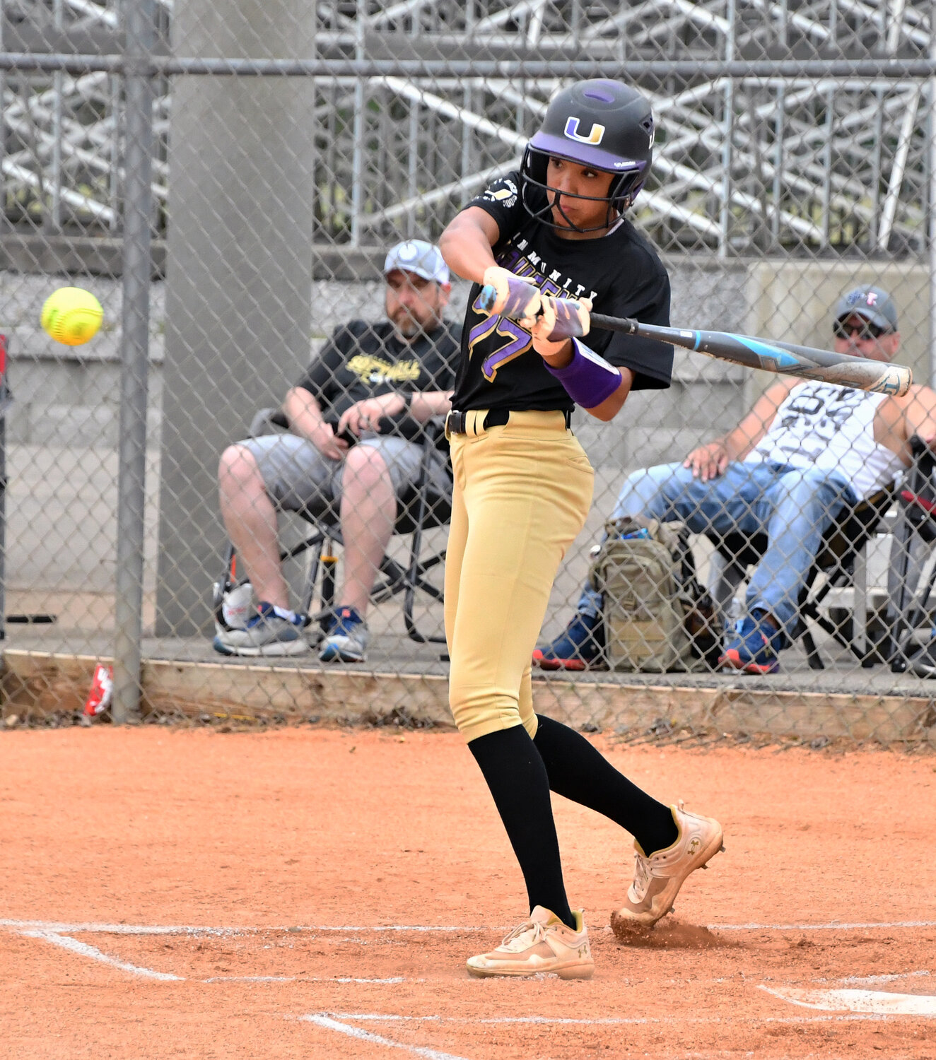 Abby Murrill keeps her eye on the ball and reaches base for the Viqueens.