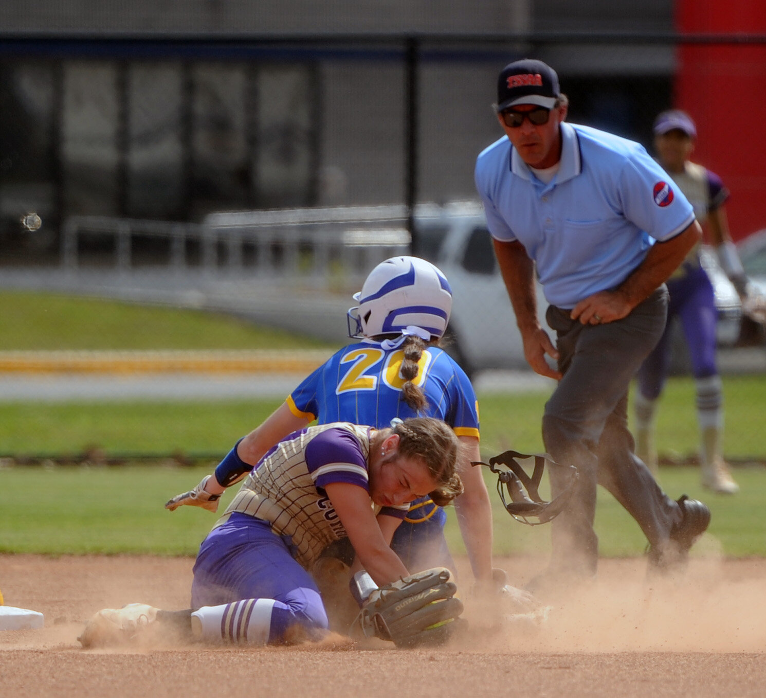 Viqueen short stop Abi Brown collides with a Westview baserunner for the out at second base during the first inning.