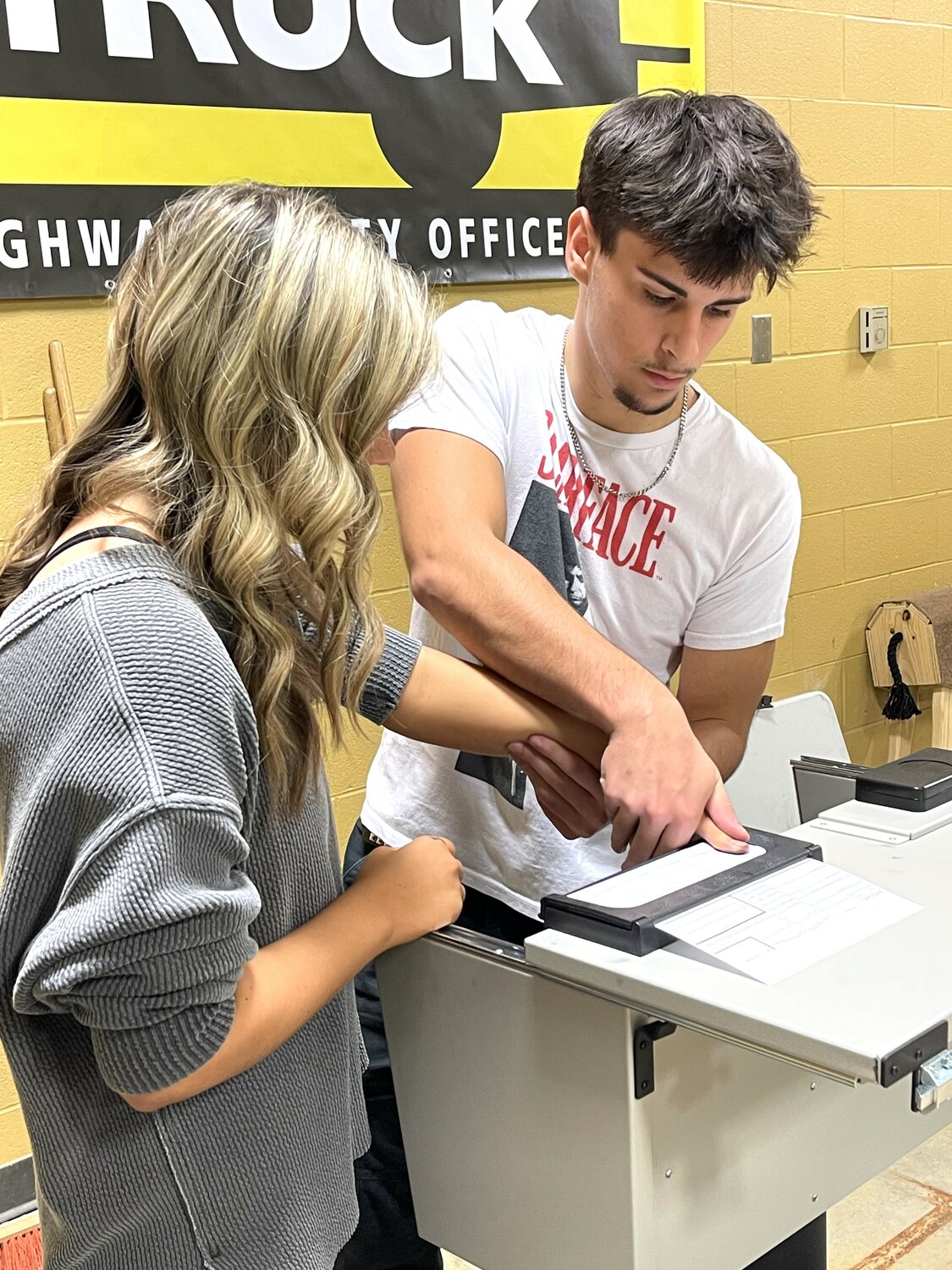 Students Ethan and Madison learn the art of fingerprinting in their criminal justice class at Community.