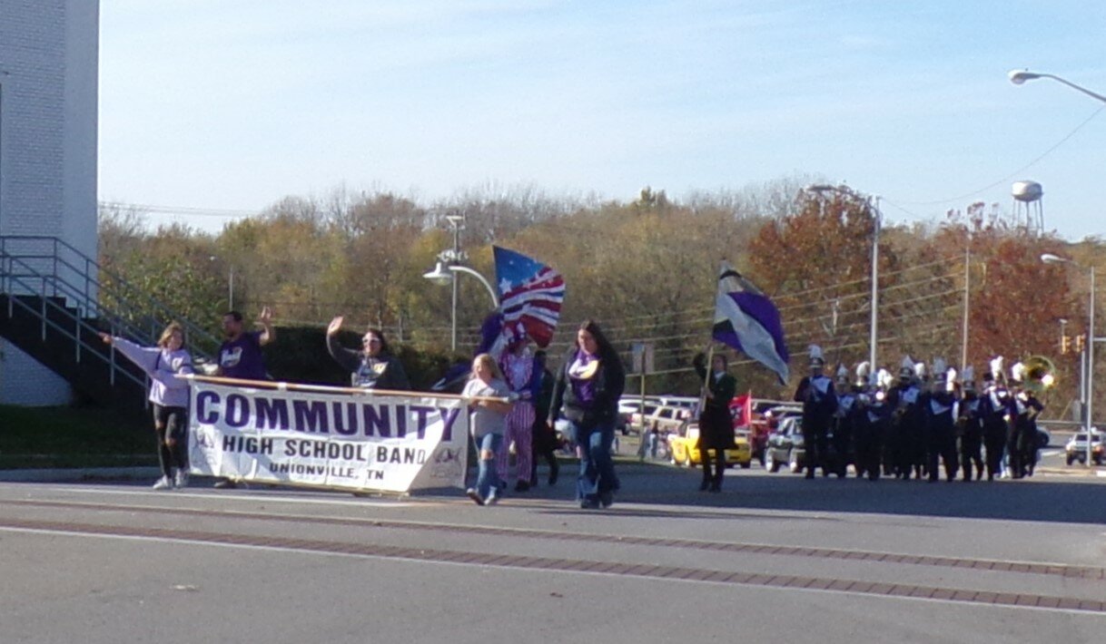 COMMUNITY HIGH SCHOOL BOARD MARCHES ON DURING VETERANS PARADE ON SATURDAY