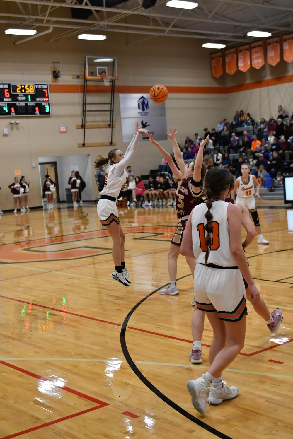 Cascade's Kaegan Young (22) fires a three over Cannon County's Abi Alexander (15). She once again led Cascade in scoring with 11 points on Tuesday.