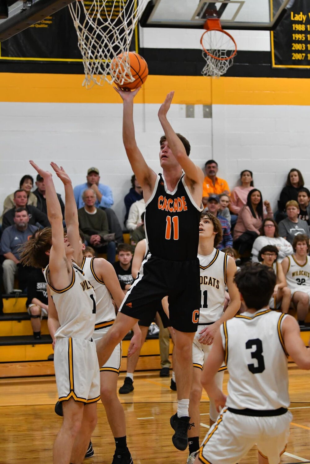 Zach Crosslin (11) goes up for two of his team-high 15 points in Friday's upset win at Santa Fe.
