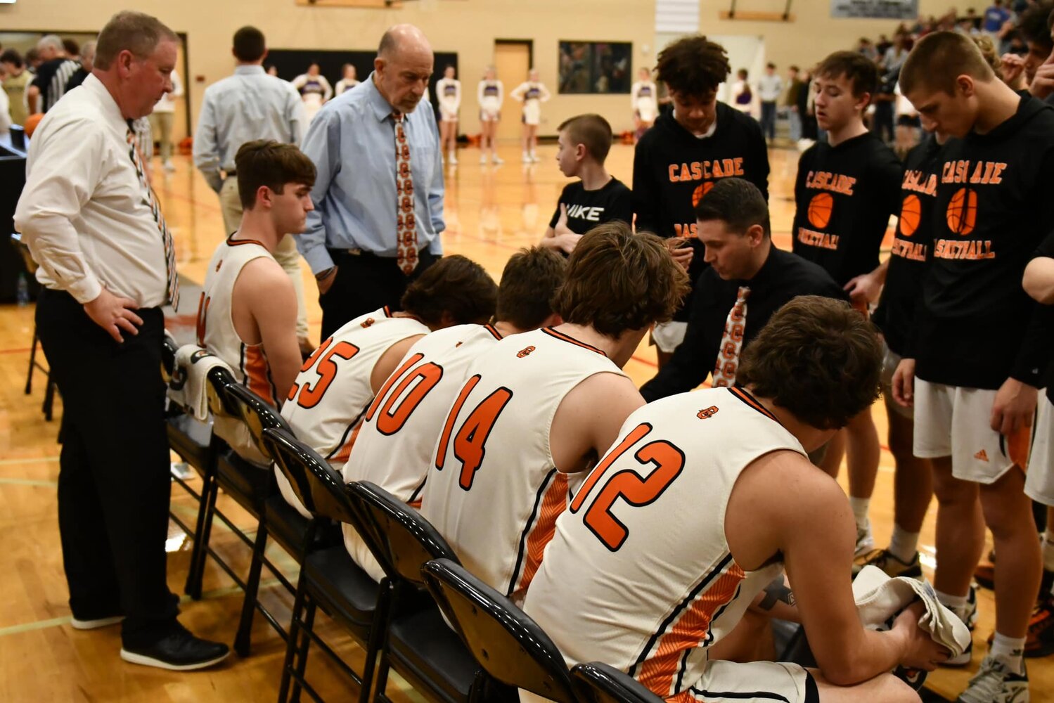 Chris Lawson (Center) gives his team final instructions before Tuesday night's matchup.