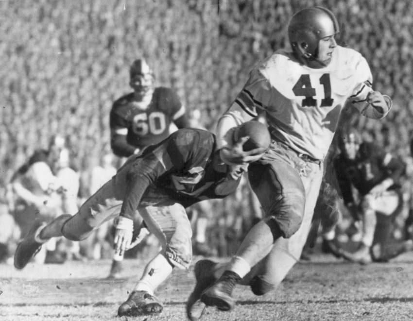 Army's Glenn Davis eludes Navy tacklers at the 1944 Army-Navy game in Baltimore, Mayland. Navy lost to Army 23-7 and the two academies would never meet again for the college football championship.