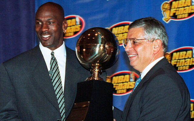 David Stern (right) shown with Michael Jordan receiving the MVP award at the 1996 NBA Finals. Their contribution to the explosion of the NBA is explored in Pete Croatto's new book, &quot;From Hang Time to Prime Time&quot;.