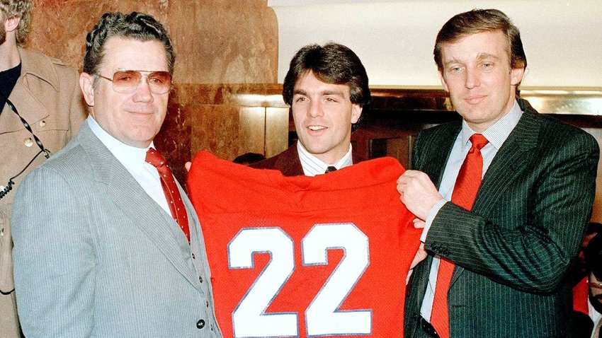 Donald Trump (right) at the February 1985 signing ceremony that brought Heisman Trophy winner Doug Flutie, center, to his New Jersey Generals. Team&rsquo;s head coach, Walt Michaels, is on the left.