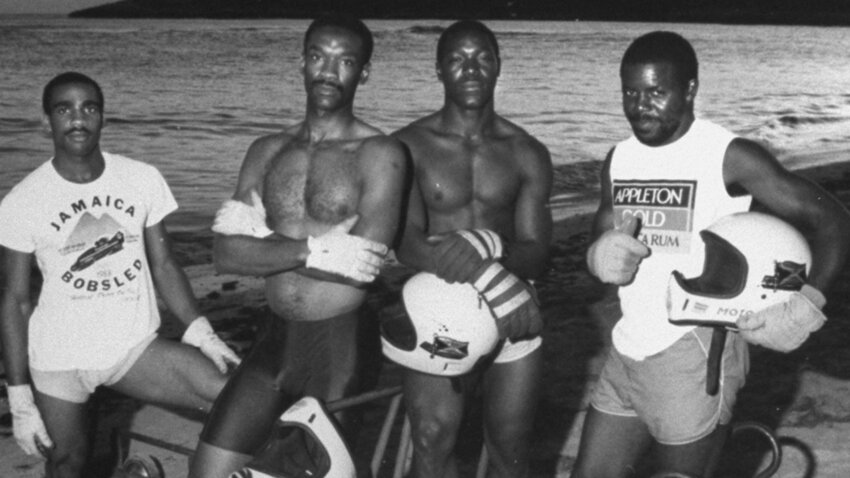 The 1988 Jamaica national bobsled team posing beachside with their training push-cart. Standing second from right is Devon Harris who would also compete at the 1992 and 1998 Winter Olympics.