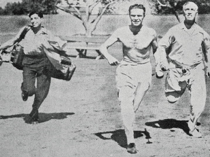 James Ferebee (center) chasing one of the holes in the 4-day, Los-Angeles to New York golf marathon that he wagered with a friend (1938).