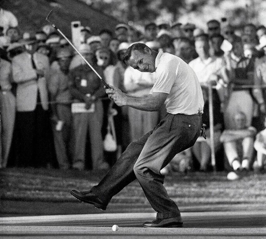 Arnold Palmer celebrating his victory at the 1960 U.S. Open where he delivered the greatest comeback in tournament history.