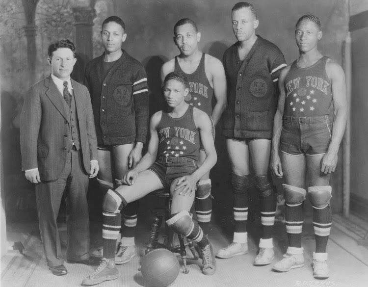 The Globetrotters of the 1930-1931 season. Standing from left: Abe Saperstein, Walter “Toots” Wright, Byron “Fat” Long, Inman Jackson, and William “Kid” Oliver. Seated: Al “Runt” Pullins. (Photo credit: Berkley Family Collection).